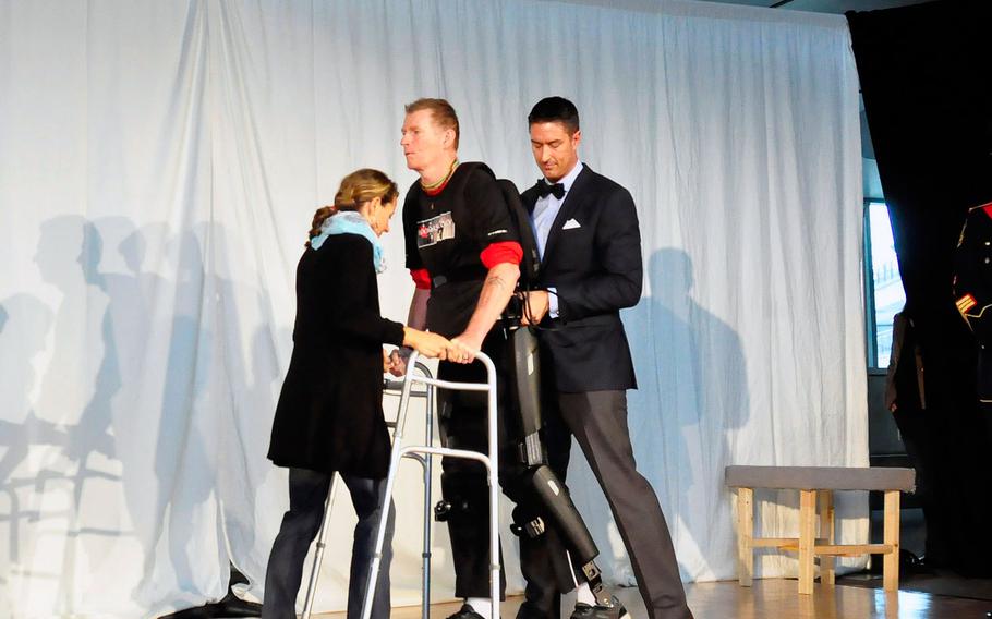 Trevor Greene, a former Canadian soldier who suffered a brain injury during an attack in Afghanistan in 2006, walks with a robotic exoskeleton, Sept. 17, 2015, at Simon Fraser University in British Columbia. This is the first time exoskeleton technology, designed for those with spinal cord injuries, has been used for a person with a brain injury, said SFU professor Carolyn Sparrey.