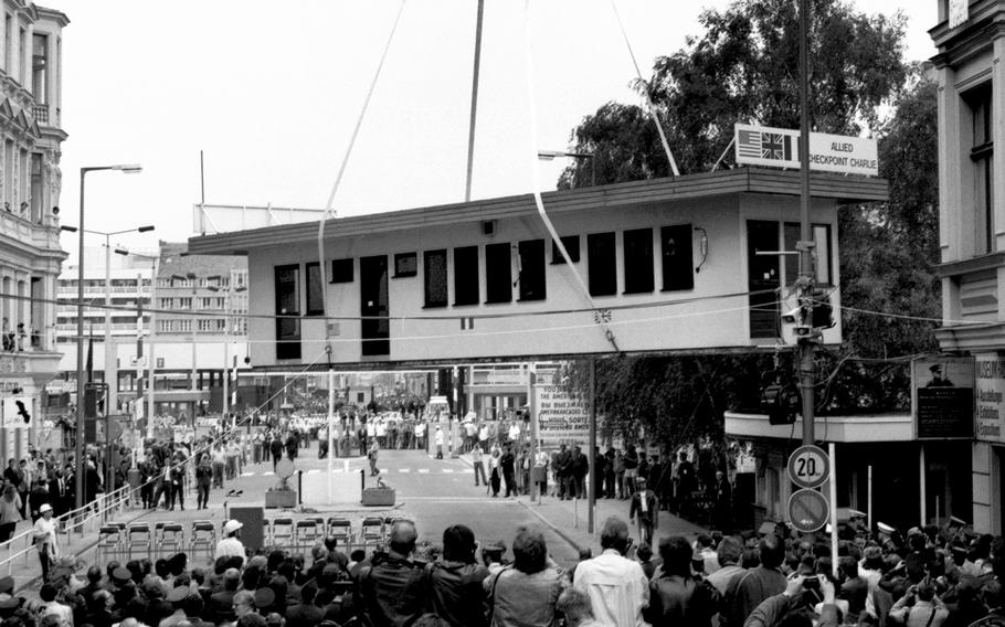 Berlin, June, 1990: Checkpoint Charlie, for decades the key border crossing between the eastern and western portions of divided Berlin, is lifted away to a waiting flatbed truck.