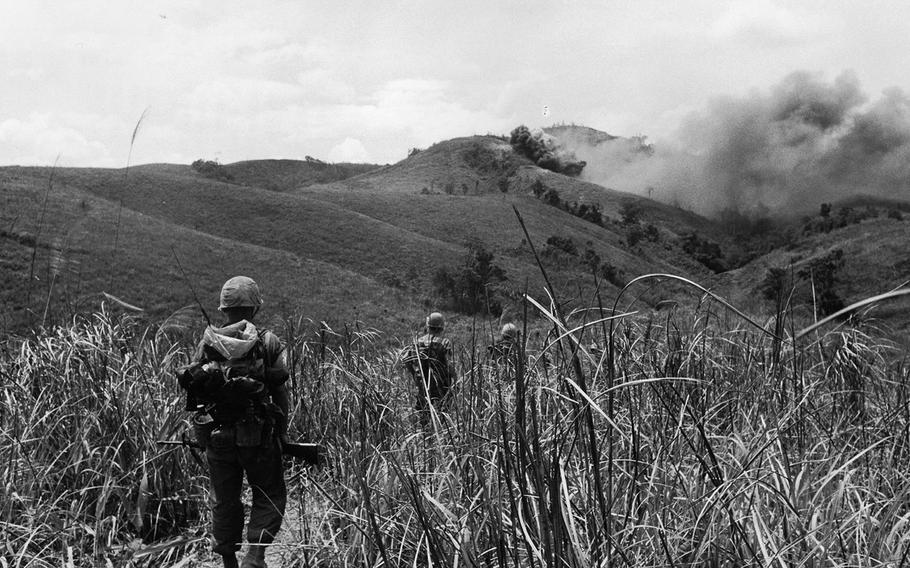 9th Regiment Marines advance in 1967 toward North Vietnamese hilltop positions under cover of Marine air strikes.  The action took place during a search-and-clear patrol just west of Phu Bai in the Republic of Vietnam.
