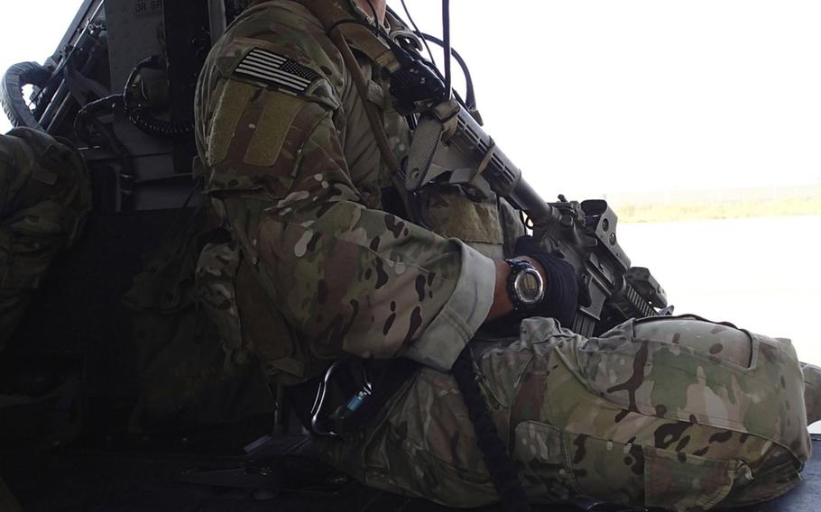 Air Force Staff Sgt. Zachary Hoeh received the the Distinguished Flying Cross with Valor for dropping into mine-laden terrain near the Afghan border with Pakistan to rescue a soldier who was frozen in the midst of an active minefield after the soldier's squad was decimated by successive IED blasts. Hoeh is seen here aboard a helicopter at Bagram Airfield in the winter of 2013-2014.