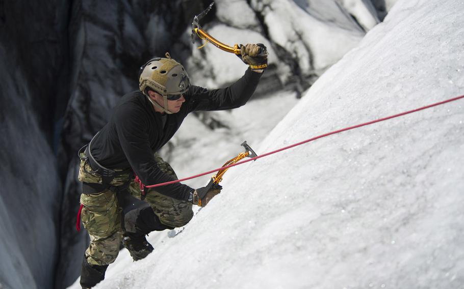Air Force pararescueman Staff Sgt. Zachary Hoeh from Kadena Air Base's 31st Rescue Squadron trains in icy conditions in Keflavik, Iceland in 2014. Hoeh was awarded the Distinguished Flying Cross with Valor for dropping into mine-laden terrain to rescue a stranded soldier in Afghanistan in 2011.