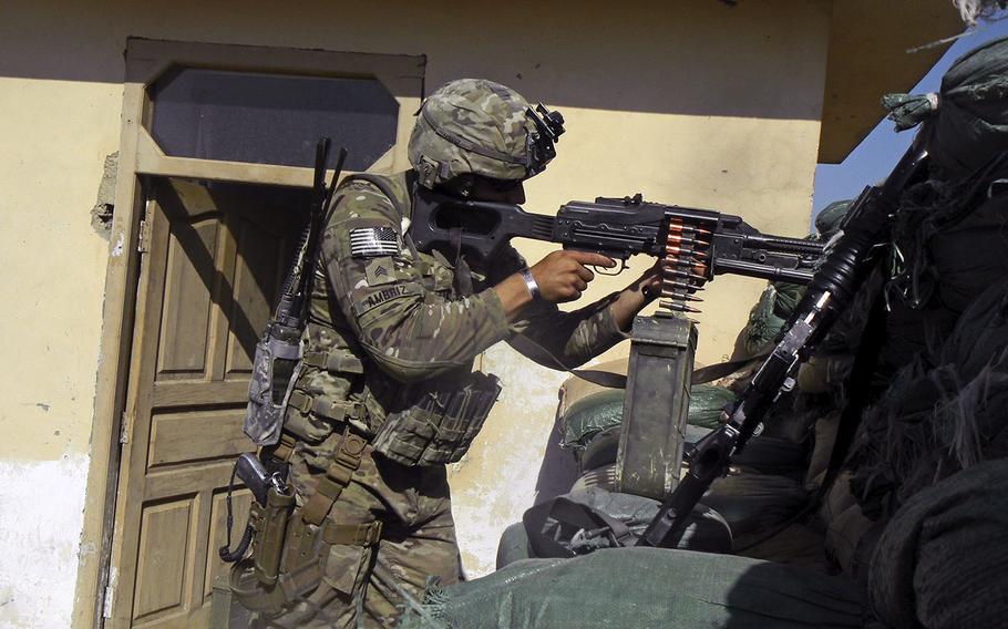 Sgt. Sean T. Ambriz mans an Afghan PKM machine gun in eastern Afghanistan.