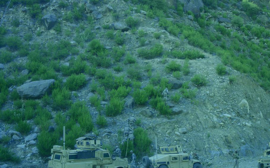 Pfc. Ambriz and a small group of American military policemen and cavalry troops head into Kunar's Saw Valley Sept. 10, 2009, to retrieve casualties and reinforce personnel pinned down deep in the valley.