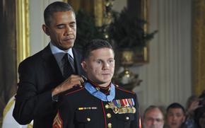 President Barack Obama awards the Medal of Honor to retired Marine Corps Cpl. Kyle Carpenter at the White House, June 19, 2014. 
