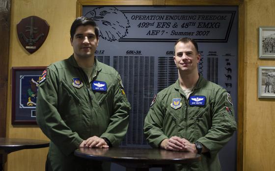 U.S. Air Force Capt. Matt Kuta, left, and Capt. Mike Benitez each received the Distinguished Flying Cross for helping to rescue a wounded servicemember in Afghanistan.