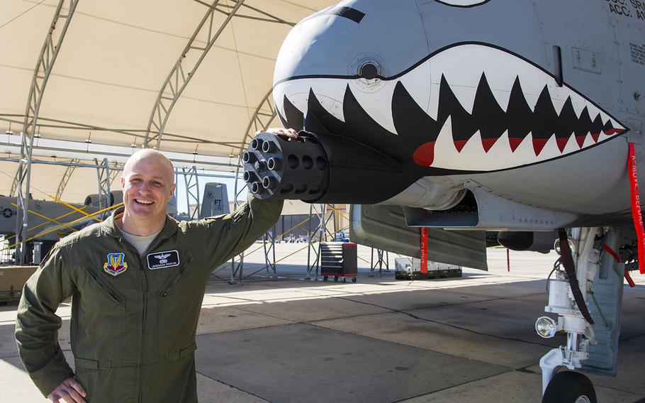U.S. Air Force Maj. Jeremiah "Bull" Parvin, 75th Fighter Squadron director of operations, poses for a photo in front of his A-10C Thunderbolt II Jan. 28, 2015, at Moody Air Force Base, Ga. Parvin was awarded the Distinguished Flying Cross with Valor Jan. 29,2015, for his selfless and heroic actions that he displayed seven years earlier during a deployment to Afghanistan.