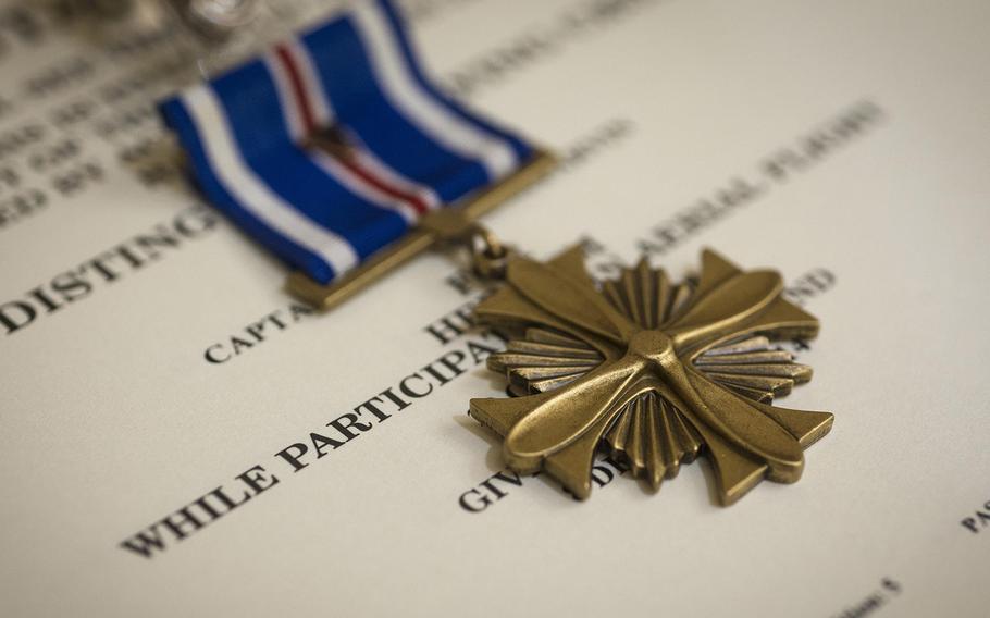 A Distinguished Flying Cross sits on display prior to being awarded to Maj. Jeremiah Parvin Jan. 29, 2015, at Moody Air Force Base, Ga. The DFC is awarded for heroism or extraordinary achievement while participating in an aerial flight. Parvin is a 75th Fighter Squadron A-10C Thunderbolt II pilot.