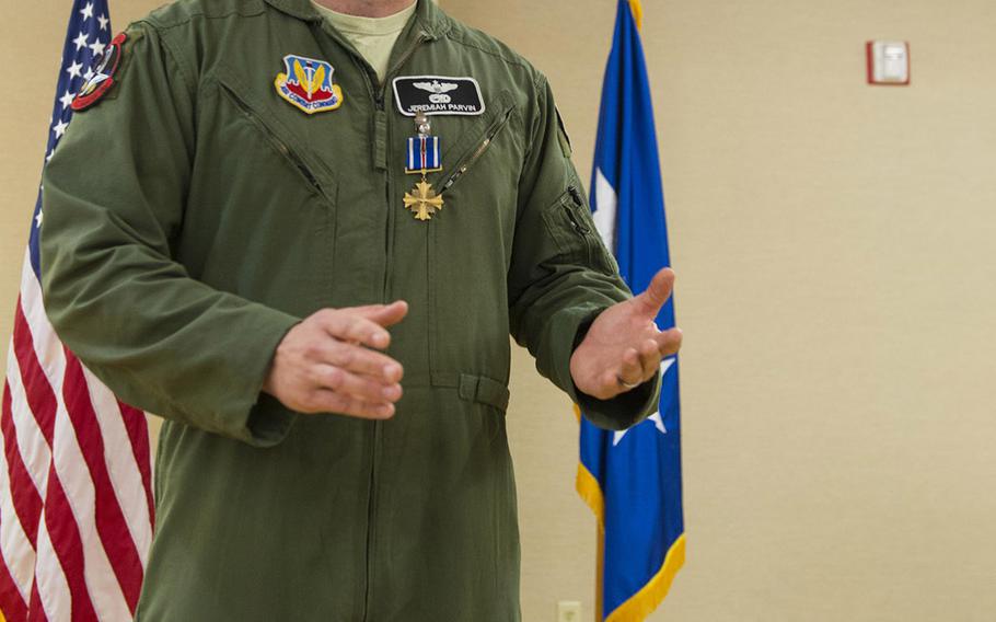 Maj. Jeremiah Parvin gives a speech during his Distinguished Flying Cross with Valor ceremony Jan. 29, 2015, at Moody Air Force Base, Ga. Maj. Gen. H. D. Polumbo Jr., the Ninth Air Force commander, presided over the ceremony and presented Parvin with the medal. Parvin is the 75th Fighter Squadron director of operations.