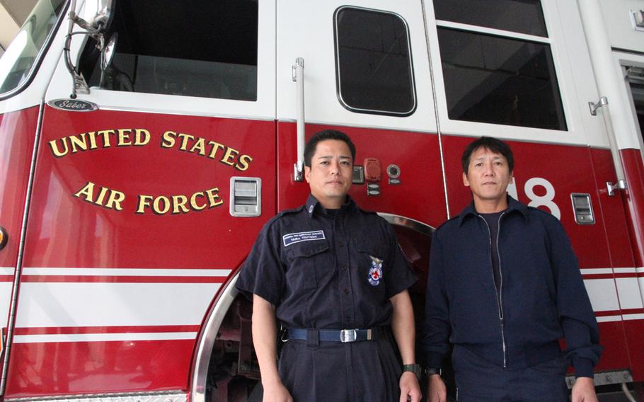 Kadena Air Base firefighters Tsuyoshi Taira, left, and Reiki Hokama are two of the 26 U.S. military and Japanese civilian first responders recognized with the harrowing rescue of two airmen trapped in a flooded building last year.