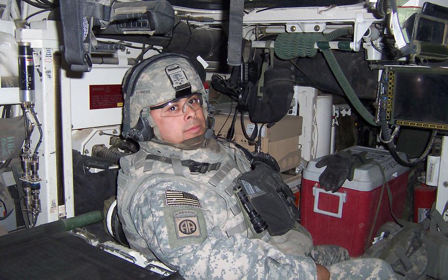 Then-1st Sgt. Viriato Ferreraramos, 1st sergeant for Company C, 2nd Battalion, 3rd Infantry Regiment, 2nd Infantry Division poses for a photograph in his Strkyer while forward deployed to Iraq, Aug. 2006.