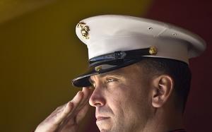 Gunnery Sergeant Brian C. Jacklin salutes before a ceremony award him the Navy Cross at Camp Pendleton. The Navy Cross is the second highest honor for the members of the Marines, Navy and Coast Guard.