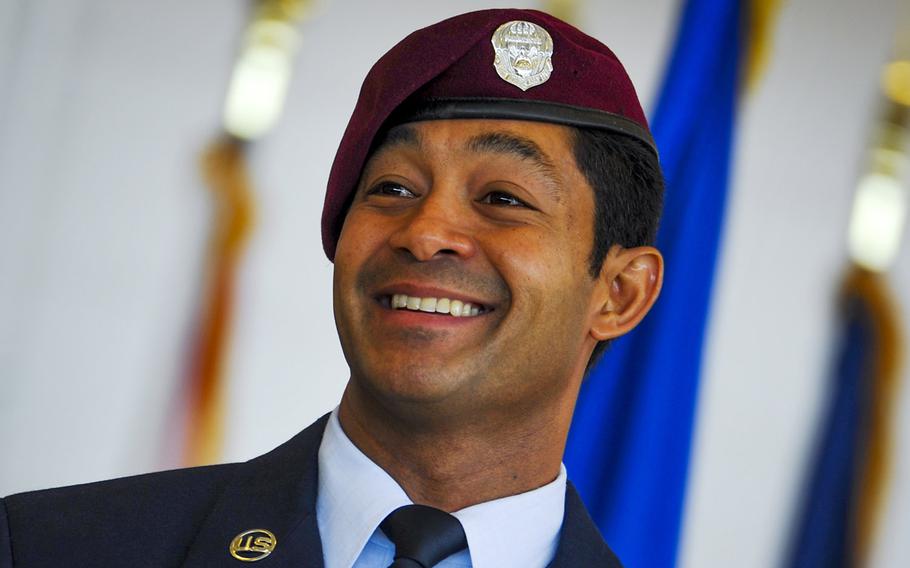Master Sgt. Ivan Ruiz, a pararescueman from the 56th Rescue Squadron, Royal Air Force Lakenheath, England, smiles after being presented the Air Force Cross for extraordinary heroism in combat during a ceremony at the Freedom Hangar on Hurlburt Field, Fla., Dec. 17, 2014. The Air Force Cross is the second highest U.S. military decoration a member of the Air Force can receive.