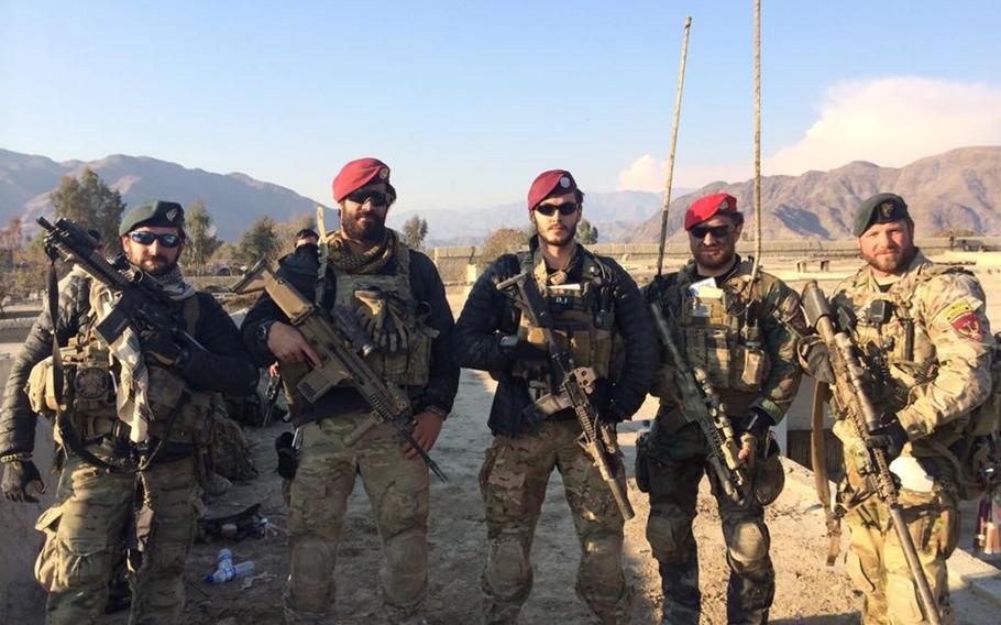 Staff Sgt. Frank Troiano, second from left, poses with teammates during a 2013 clearing operation in Charikar, Afghanistan.
