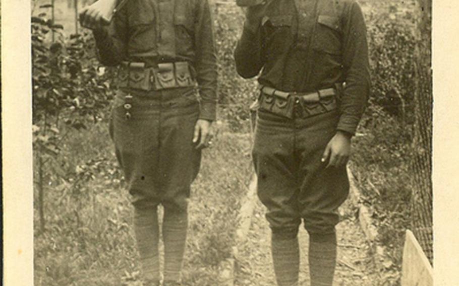 Photo of Sgt. William Shemin (right) and another soldier.