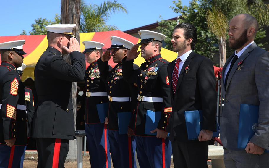 Major Gen. Joseph L. Osterman, commander, U.S. Marine Corps Forces, Special Operations Command, presents five Marines with Bronze Star Medals with valor distinguishing devices, at Marine Corps Base Camp Pendleton, Ca., April 9, 2015. The five Marines received the awards in recognition of their actions during a two-day fire fight with the Taliban in Helmand province, Afghanistan, which started June 14, 2012.
