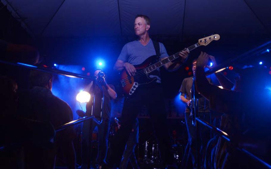 Actor and Lt. Dan Band bassist Gary Sinise jams on stage at a concert and block party dedicated to Medal of Honor recipients in Honolulu on Oct. 5, 2012. The concert was part of the weeklong 2012 Medal of Honor Convention. The reunion of 52 medal recipients is thought by organizers to be the largest ever gathering of its kind.
