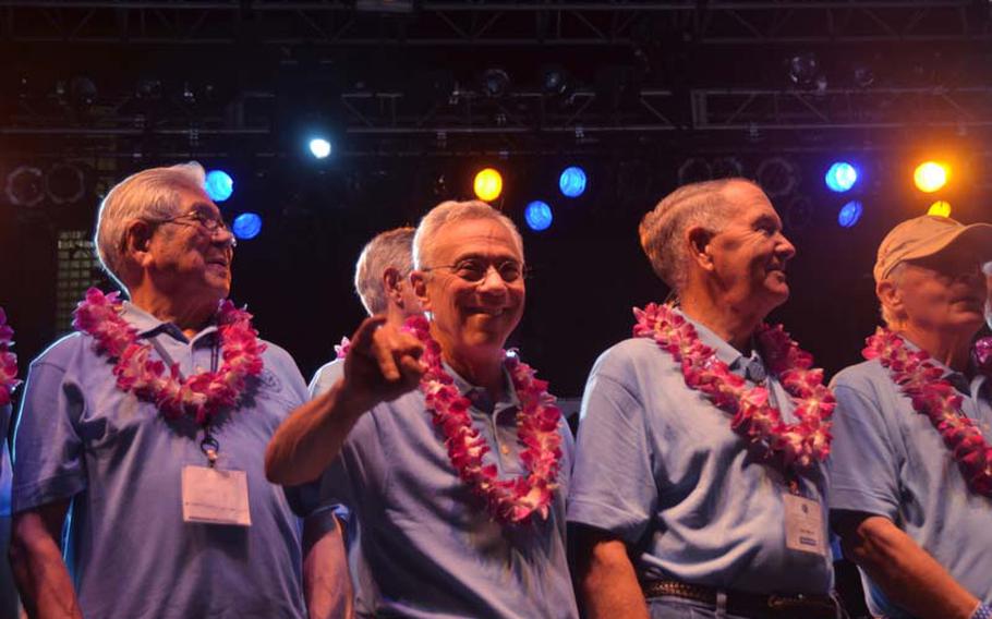 Medal of Honor recipient Jack Jacobs, center, flashes the Hawaiian "shaka" sign while on stage at a concert and block party in Honolulu on Oct. 5, 2012. Also pictured on his left is medal recipient Hiroshi Miyamura, and on the right is recipient Walter Marm, Jr. The concert, headlined by Gary Sinise and the Lt. Dan Band, was part of the 2012 Medal of Honor Convention. The reunion of 52 medal recipients is thought by organizers to be the largest ever gathering of its kind.