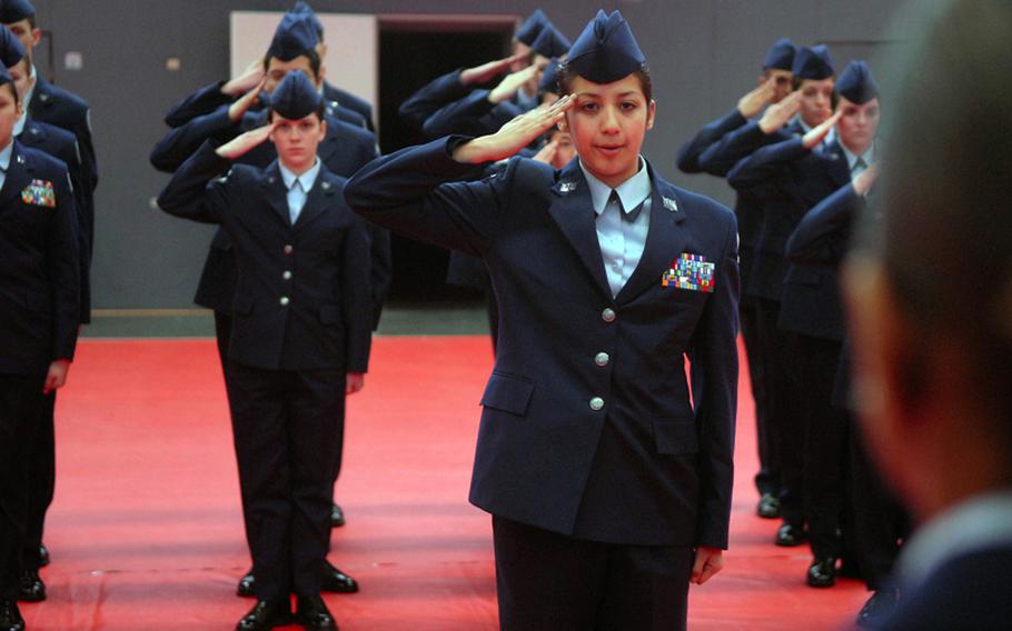 Aviano High School senior Melanie Vasquez requests permission to use the drill pad during the Regulation Drill competition in March at Kaiserslautern High School.