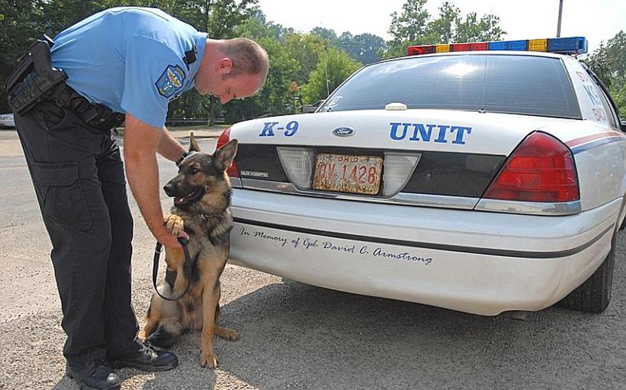 Officer Mike Schiele with Tino. The community raised $15,000 in honor of Zanesville-resident Cpl. Dave Armstrong, who was killed in Iraq, to purchase the department a K9-trained dog and outfit a squad car. The dog, named Bosco, was injured along with Schiele last August in a shooting. Bosco doesn’t work the streets anymore but is the ambassador for the department. A furniture store donated the money to buy Tino as a replacement.