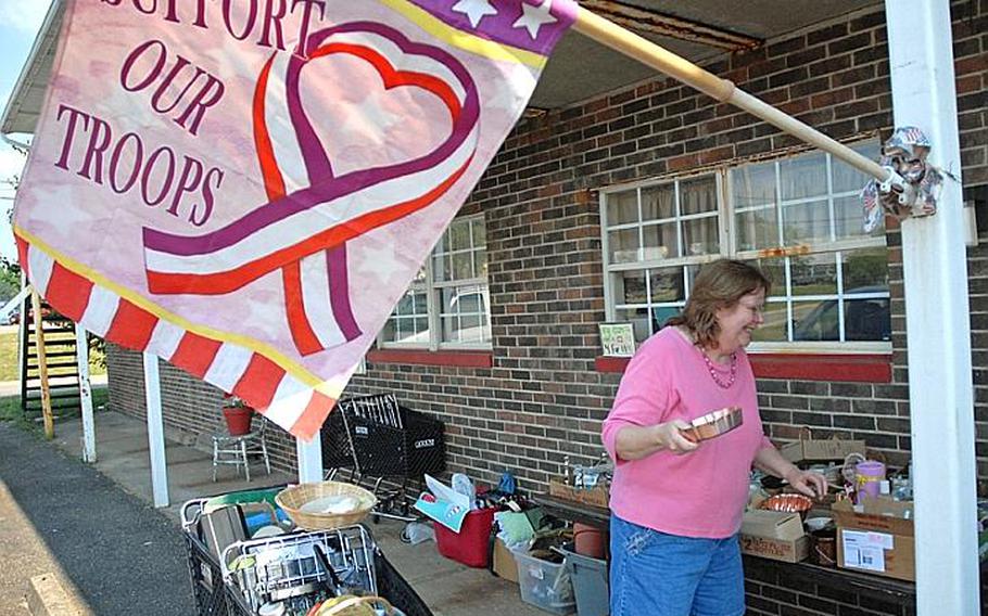 Melodie Pittman organizes wares for sale last month at her Zanesville, Ohio, Twice-Loved Thrift Store, the profits of which go to support Operation Spirit Inc. Troop Support Ministry that sends care packages to troops deployed downrange. Pittman’s efforts started in 2003 when she mailed books to troops through www.booksforsoldiers.com with the username “somebodysmother.”