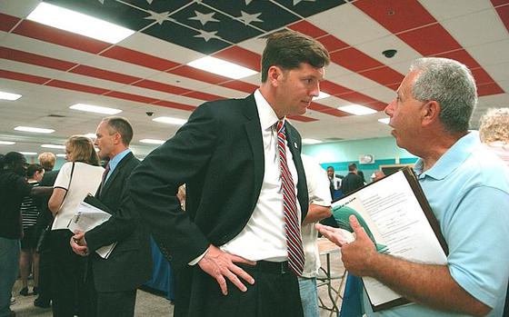 Rep. Patrick Murphy speaks to a constituent at a job fair in Pennsylvania in July 2010.
