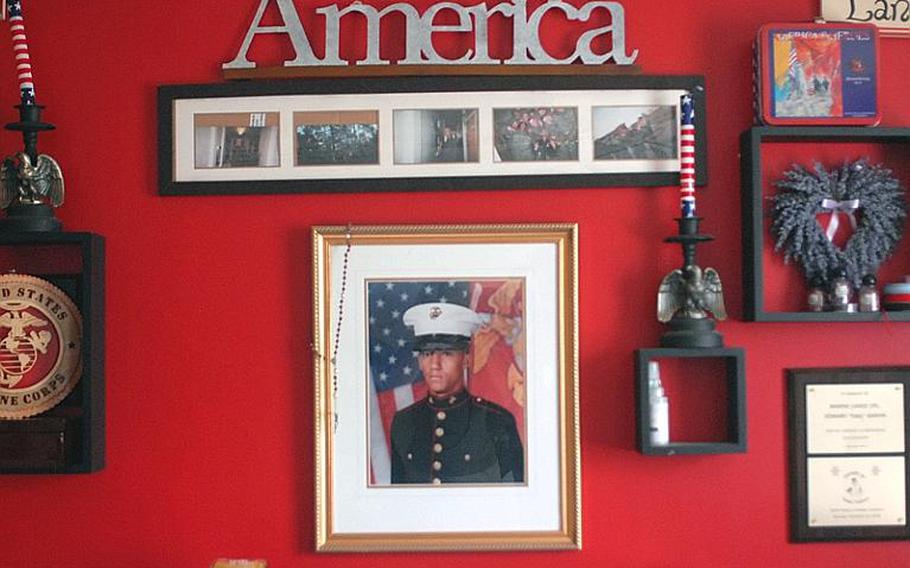 Marine Pvt. Eddy Garvin's photo hangs on a wall in a room of the house Melissa devoted to his memory.