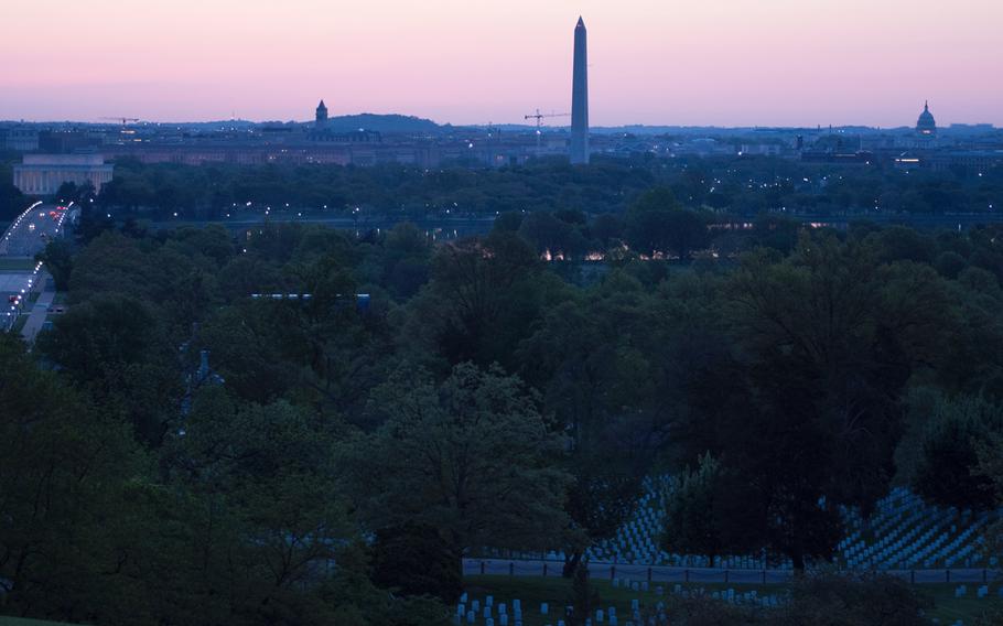 Arlington National Cemetery is still partly dark before the sun rises on May 4, 2014. 