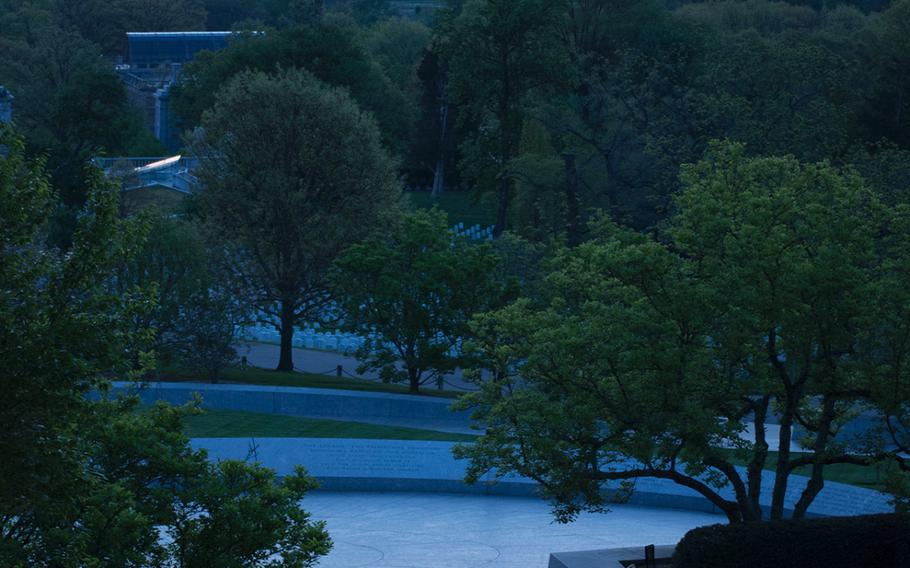 President John F. Kennedy's eternal flame glows in the early morning hours of May 4, 2014. 