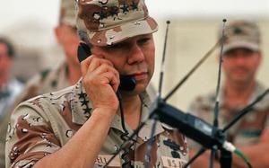 Chairman of the Joint Chiefs of Staff Gen. Colin Powell speaks via satellite to the Pentagon while visiting troops during Operation Desert Shield.  