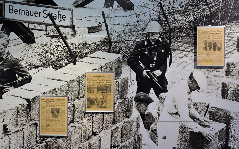Three editions of The Stars and Stripes with front page stories on the building of the Berlin Wall in 1961 along with a photo of the event are on display at the Allied Museum in Berlin.