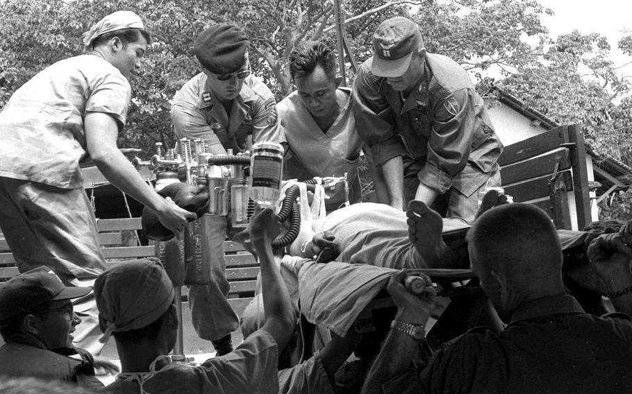 A badly-wounded U.S. Special Forces sergeant is moved from a small field hospital to Saigon in 1965.