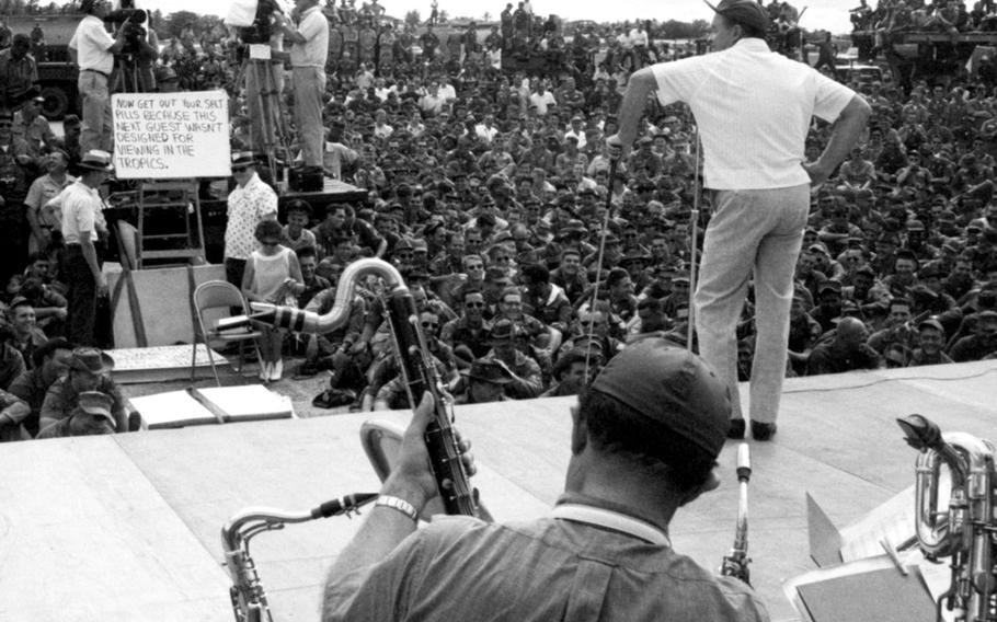 December, 1965: Bob Hope delivers a monologue during his annual Christmas show for U.S. troops. Hope was joined by a cast that included Carroll Baker and Kaye Stevens, singers Jack Jones and Anita Bryant, comedian Jerry Colonna, and Miss USA Dianna Lynn Batts. Maj. Ed Swinney, who took the photo, was Stars and Stripes' executive officer at the time; in his previous assignment, he handled logistics for Hope's annual tours.