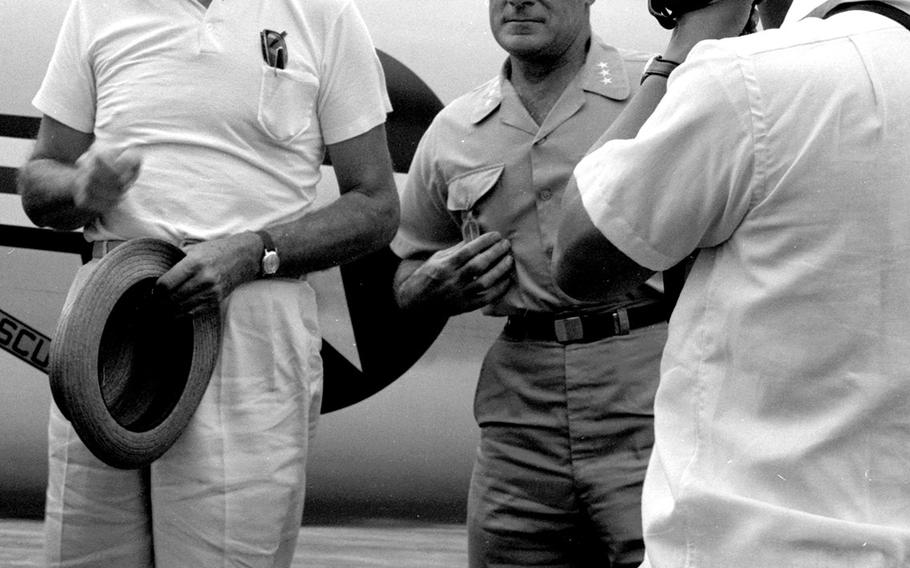 December, 1965: U.S. Ambassador to South Vietnam Henry Cabot Lodge, left, poses as he arrives aboard the USS Enterprise off the coast of Vietnam. Also visiting the world's first nuclear-powered aircraft carrier was South Vietnamese Prime Minister Nguyen Cao Ky.