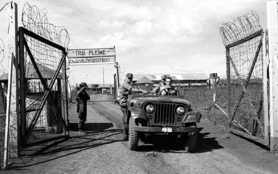 December, 1965: Servicemembers pass through the gate of the Plei Me Special Forces camp. Two months earlier, a handful of American troops and about 250 Montagnard tribesmen living nearby held off a Viet Cong attack on the camp until reinforcements arrived.