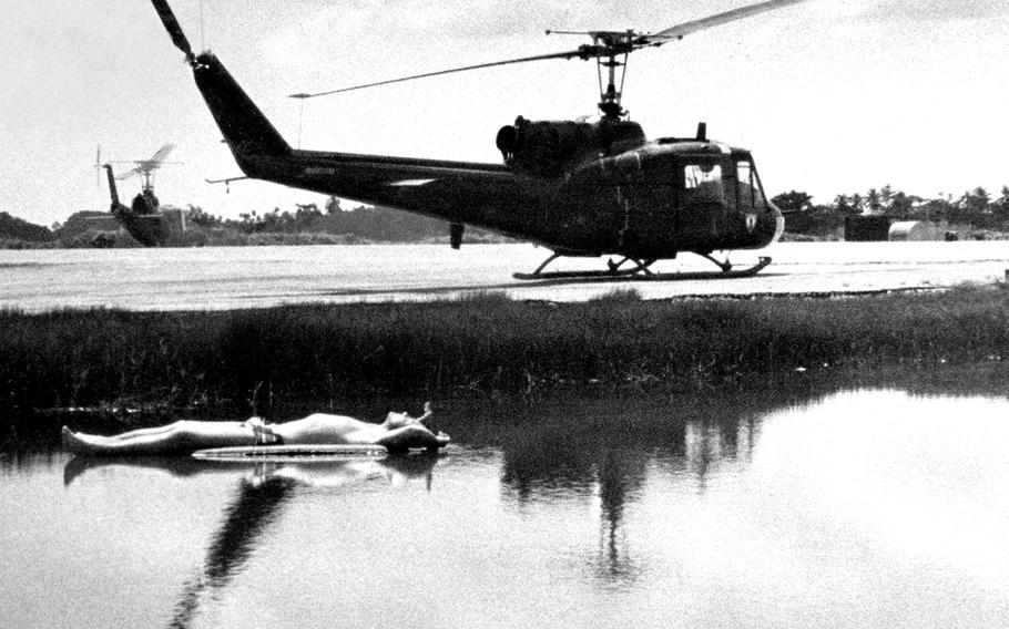 November, 1965: Warrant Officer Tom Allen soaks up some sun in a marshy pond near the flight line at the tiny Vinh Long airfield, home of the U.S. Army's 502nd and 114th Aviation Battalions, in South Vietnam's Mekong Delta region. 