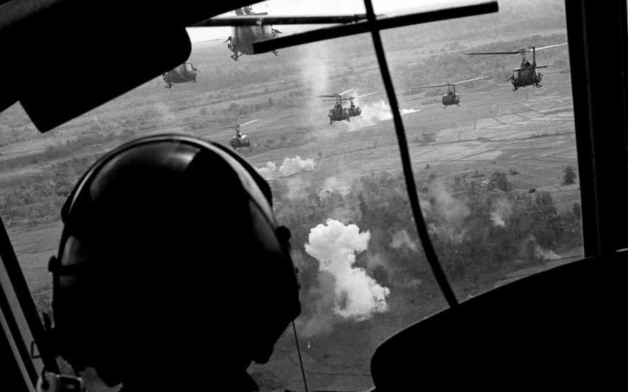 May, 1965: U.S. helicopters rake the perimeter of a landing zone with rockets and machine-gun fire before dropping off troops brought in from Binh Hoa.   