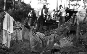 Soldiers prepare breakfast near Plei Me, Vietnam, in November, 1965.