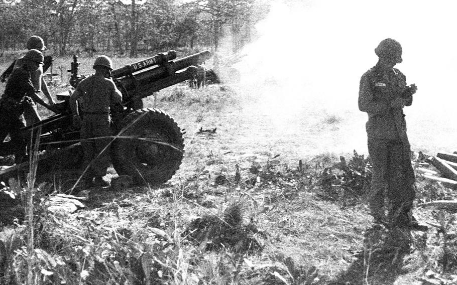 Soldiers from an artillery battalion fire a 105mm howitzer in support of 1st Cavalry troops fighting near Plei Me, Vietnam, in November, 1965.