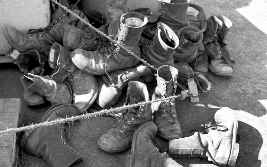 Boots taken from the bodies of 1st Cavalry Division troops killed in action near Plei Me are stacked up as a grim reminder of the toll of fighting in November, 1965.