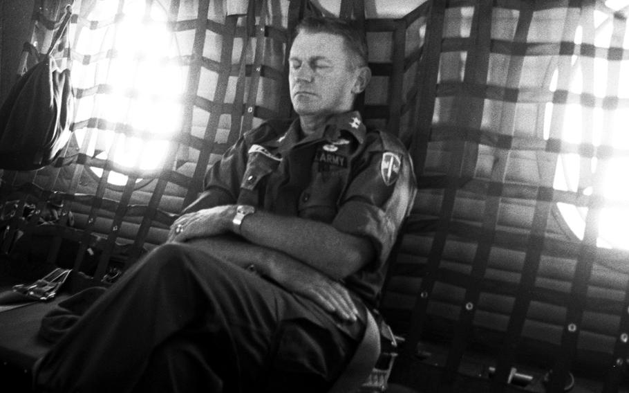 Army Maj. Gen. Stanley R. Larsen, commander of U.S. Field Forces, Vietnam, gets a few moments of sleep on a flight from Nha Trang to Pleiku, Vietnam, in November, 1965.