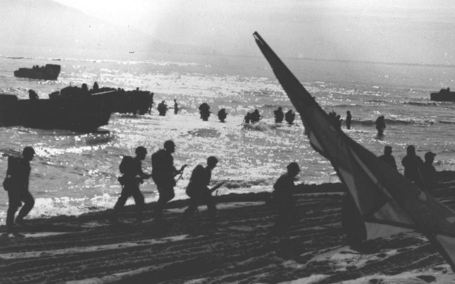 Beach activity at Da Nang, Vietnam, during landing of Marines of the 9th Marine Expeditionary Brigade in March 1965.