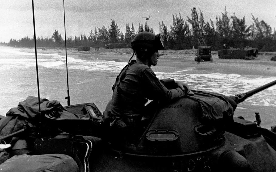 Marines landing tanks from the USS Vancouver at Da Nang beach area. 