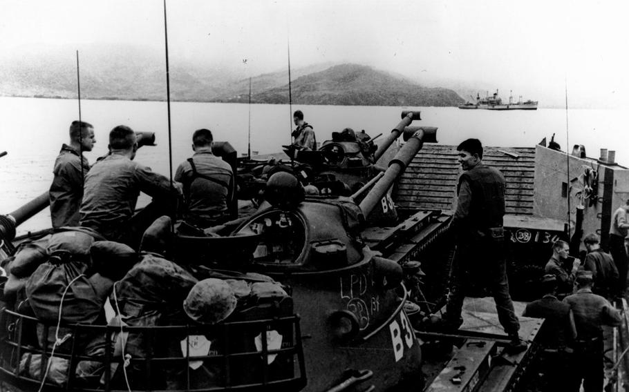 Marines landing tanks from the USS Vancouver at Da Nang beach area. 
