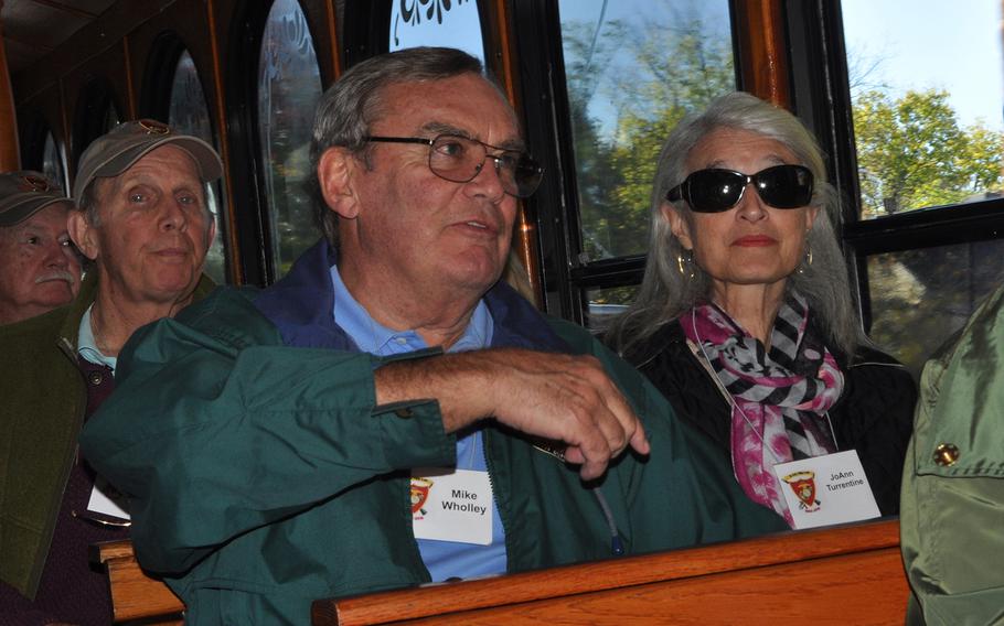 Retired Brig. Gen. Mike Wholley, center, and his friend Joanne Turrentine, right, participate in a bus tour of Fredericksburg, Va, during the 50th reunion of his classmates at The Basic School in 1966. The five months of Marine Corps officer training bonded the men before they went off to Vietnam.