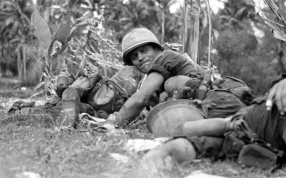 Army Staff. Sgt. Joe Musial, pinned down by enemy fire next to dead and wounded comrades. 