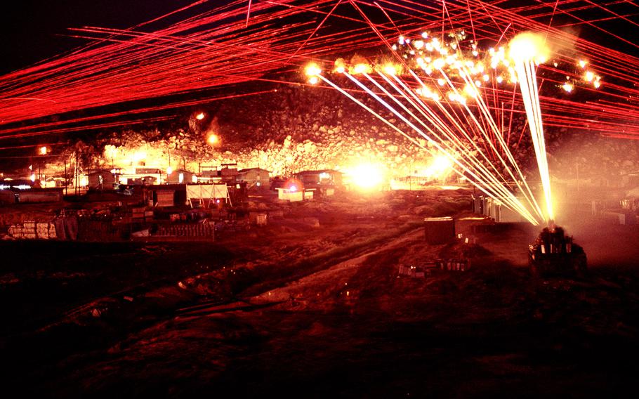 As described by James Speed Hensinger: "Time exposure of M60 7.62 cal. machine guns, M2 .50 cal. Browning machine gun, and twin 40 mm anti-aircraft Bofor (Pom-Pom) guns mounted on a M42 Duster (tank) firing long bursts of tracers at night."
