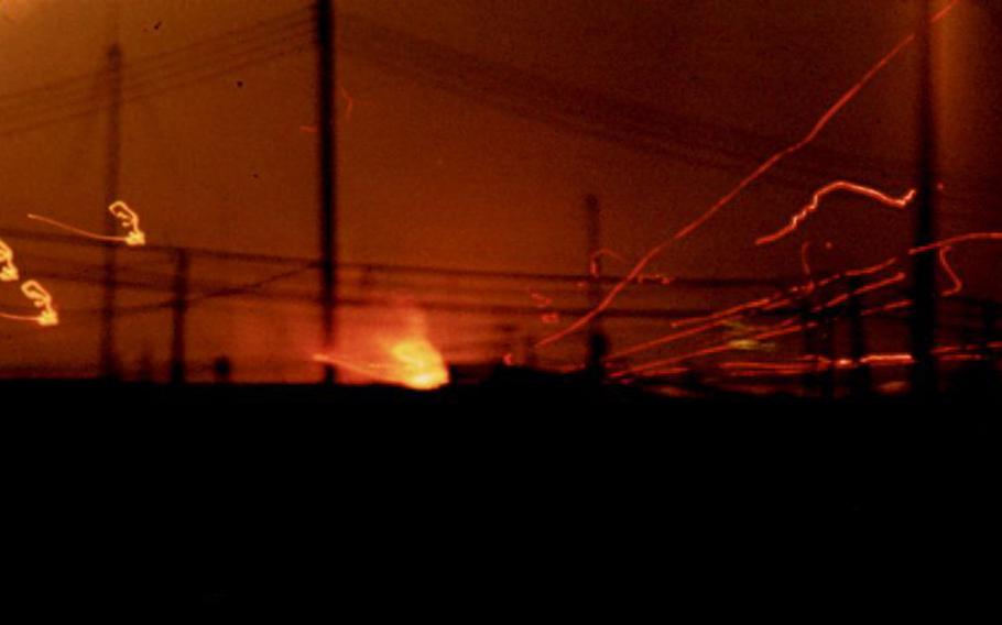As described by Philip J. Milio: "Firefight at night. A brief time-exposure of a nearby attack during the 1969 Tet Offensive."