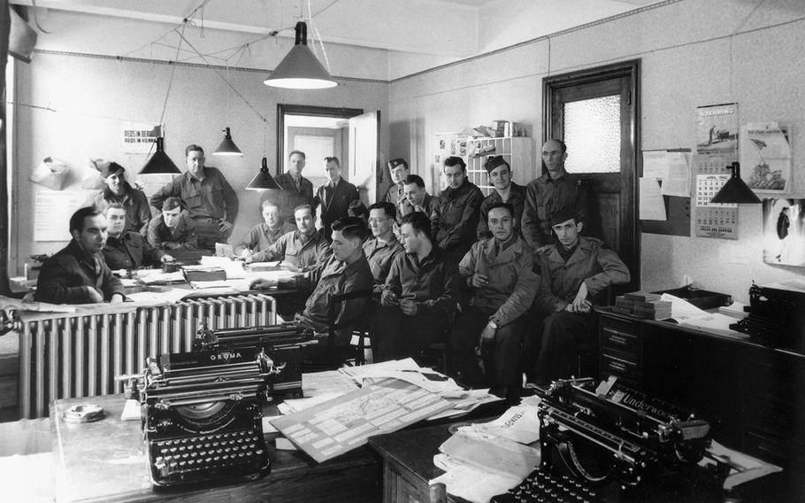 Charles Kiley, second from left, takes a break at the Stars and Stripes office in Liege, Belgium, in April 1945. 