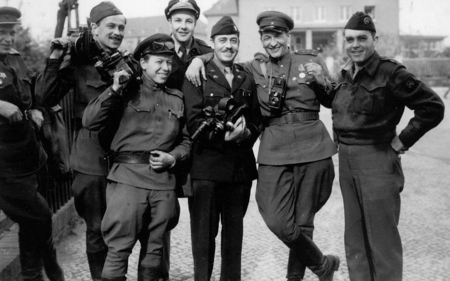 Charles Kiley, right, Dick Underwood, Gen. Dwight Eisenhower’s personal pilot, background, and Signal Corps photographer Leo Moore, center, pose with Russian photographers at the second German surrender in Berlin in May 1945. 