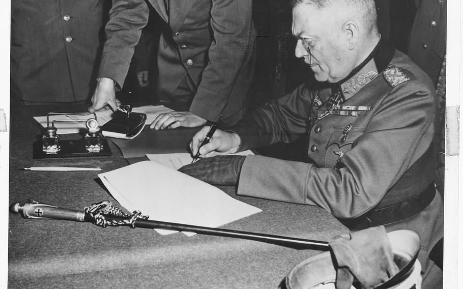 German Field Marshal Wilhelm Keitel, signs the ratified surrender terms for the German army at Russian headquarters in Berlin, on May 9, 1945.

